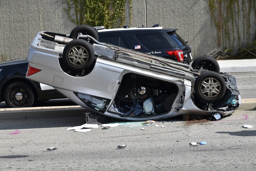 Decorative Image - Turned over car in a car accident scene