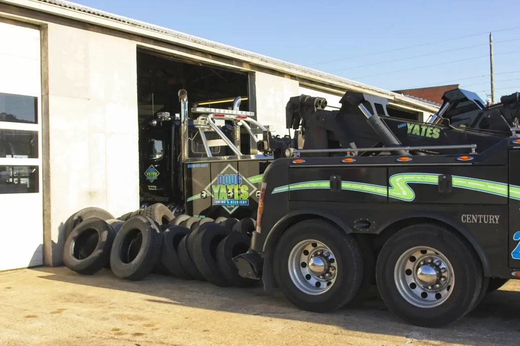 Doug Yates Towing & Recovery trucks surrounded by tires