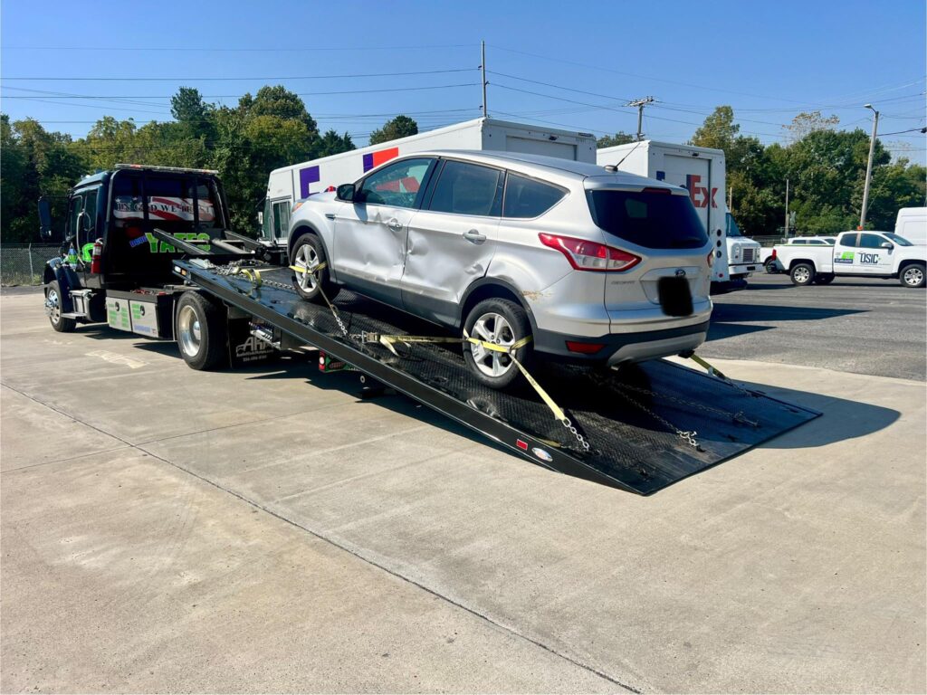 Tow Truck Loading Wreck Vehicle | Doug Yates Towing & Recovery